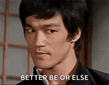 bruce lee is looking at the camera with the words `` better be or else '' written on his face .