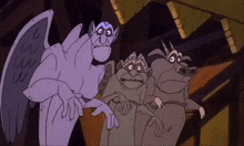 three gargoyles are standing next to each other and one of them has the letter w on it