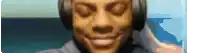 a close up of a man wearing headphones and smiling
