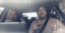two women are sitting in a car and the date is sunday