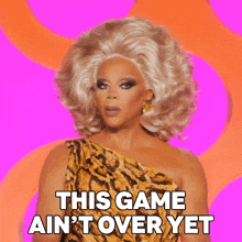 a woman in a leopard print dress says this game ain t over yet