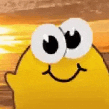 a close up of a yellow cartoon character with big eyes and a smiling face .