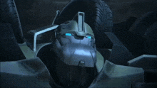 a close up of a robot 's face with blue lights