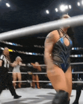 a woman in a wrestling ring with the words skyeblue official written on the bottom