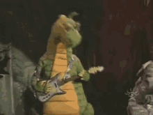 Dudley The Dragon Guitar GIF - Dudley The Dragon Guitar Rocking Out GIFs