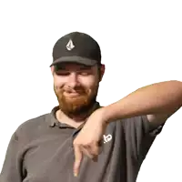 a man with a beard wearing a black hat and a grey shirt with the letter e on the front
