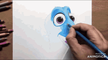 a person is drawing a cartoon character on a piece of paper with a blue pencil
