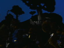 a group of stuffed animals are standing in the dark with a fence in the background