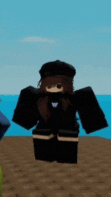 a girl in a black hat is standing on the beach .