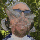 a man with a beard wearing sunglasses and headphones says that george washington gif guy better not make this gif