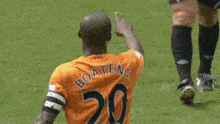 a soccer player with the name boateng on his shirt