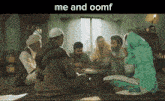 a group of people are sitting around a table with the words me and oomf above them