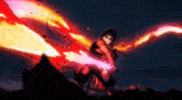 a man in a mask is holding a sword with flames coming out of it .