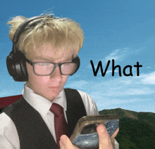 a man wearing glasses and headphones is holding a cell phone with the word what written on the bottom