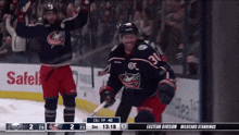 a hockey game is being played between eastern division and wildcard standings