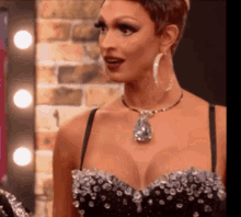 a woman wearing a black dress and a necklace