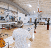 a ncaa basketball is being thrown on the court
