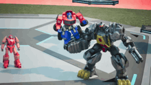 a group of transformers are standing on a concrete surface