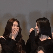 two women are laughing together with one wearing a choker that says " off white " on it