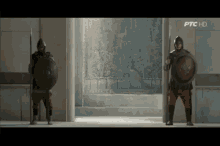 two soldiers holding shields and spears in a hallway with ptc hd on the bottom