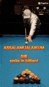 a man is playing pool on a blue pool table with the caption assalaamualaikum sib smile in billiard
