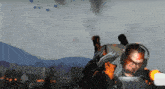 a man with a gun on his back is surrounded by fire