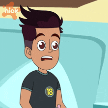 a boy with the number 18 on his shirt