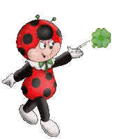 a ladybug is holding a green four leaf clover in her hand