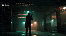 a man holding a gun in a dark room with sora written on the bottom
