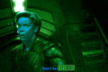 a green background with a person 's hand and the words " don 't be green "