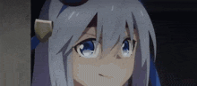 a close up of a girl with white hair and blue eyes looking at the camera .