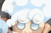 a close up of a cartoon character with a crown on her head