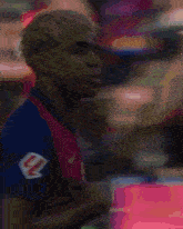 a blurred image of a man wearing a nike jersey