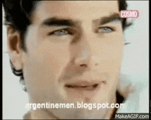 a close up of a man 's face with the words cosmo on the bottom right