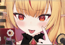 a close up of a girl 's face with a sticker on her phone that says ' witch '
