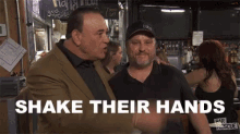 two men shake their hands in front of a sign that says happy hour