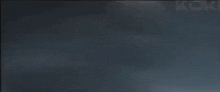 a blurry picture of a storm with the word mgm on the bottom right