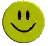 a yellow smiley face with two eyes and a smile on it .