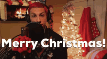 a man with red hair singing merry christmas
