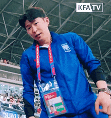a man wearing a blue jacket that says korea