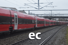 a red train is on the tracks with the letter ec below it