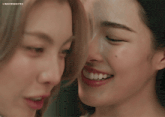 a close up of two women 's faces with lingormoifss written on the bottom right