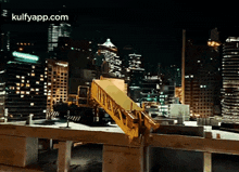 a construction site at night with a gulfyapp.com logo