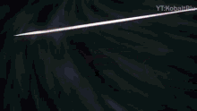 a close up of a sword on a black background with the words yt : kobaltblu on the bottom