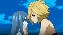 a man and a woman are looking at each other