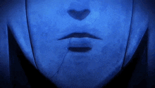a close up of a person 's face with a crack in it and a blue background .