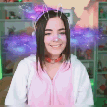 a girl wearing bunny ears and a choker smiles