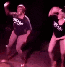 a man and a woman are dancing together on a stage .