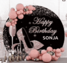 a happy birthday sign with pink balloons , a high heel , a champagne glass and candles .