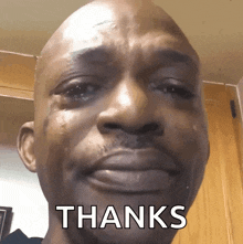 a man is crying with tears running down his face and the word thanks is written below him